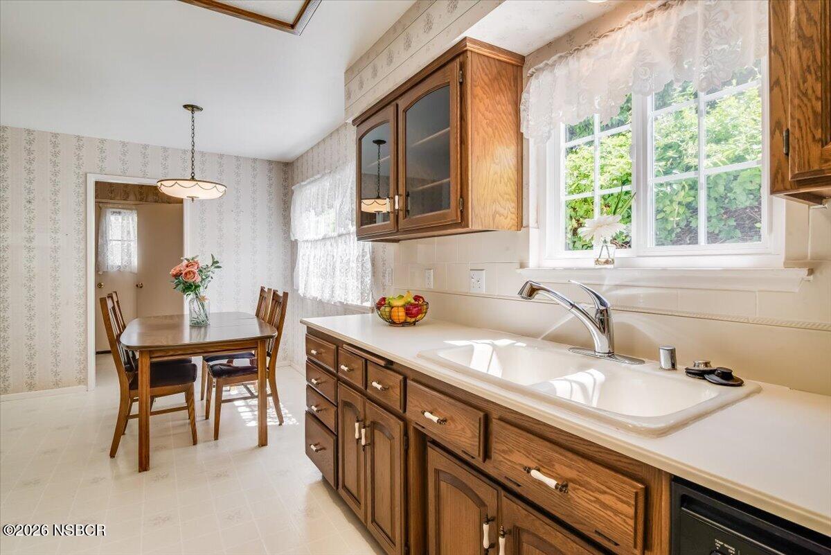 416 South Hawthorne Street Lompoc, CA 93436 - Photo 9 of 29 a kitchen with a sink cabinets and window
