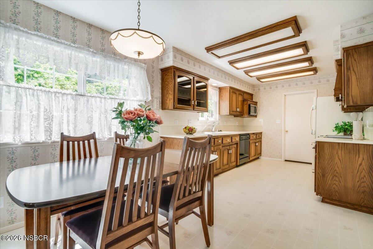 416 South Hawthorne Street Lompoc, CA 93436 - Photo 10 of 29 a view of a dining room with furniture and wooden floor