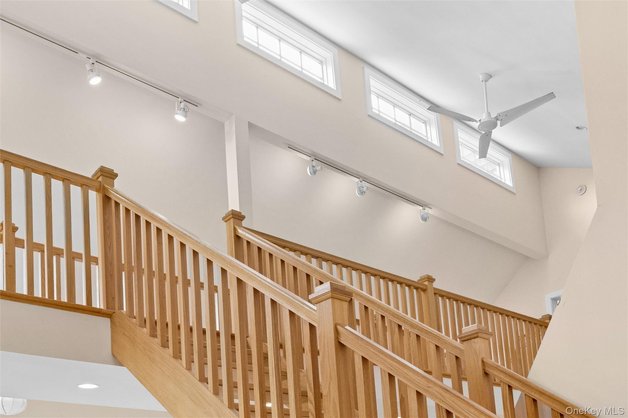 131 Red Creek Road Hampton Bays, NY 11946 - Photo 19 of 35 a view of staircase with railing and a stairs