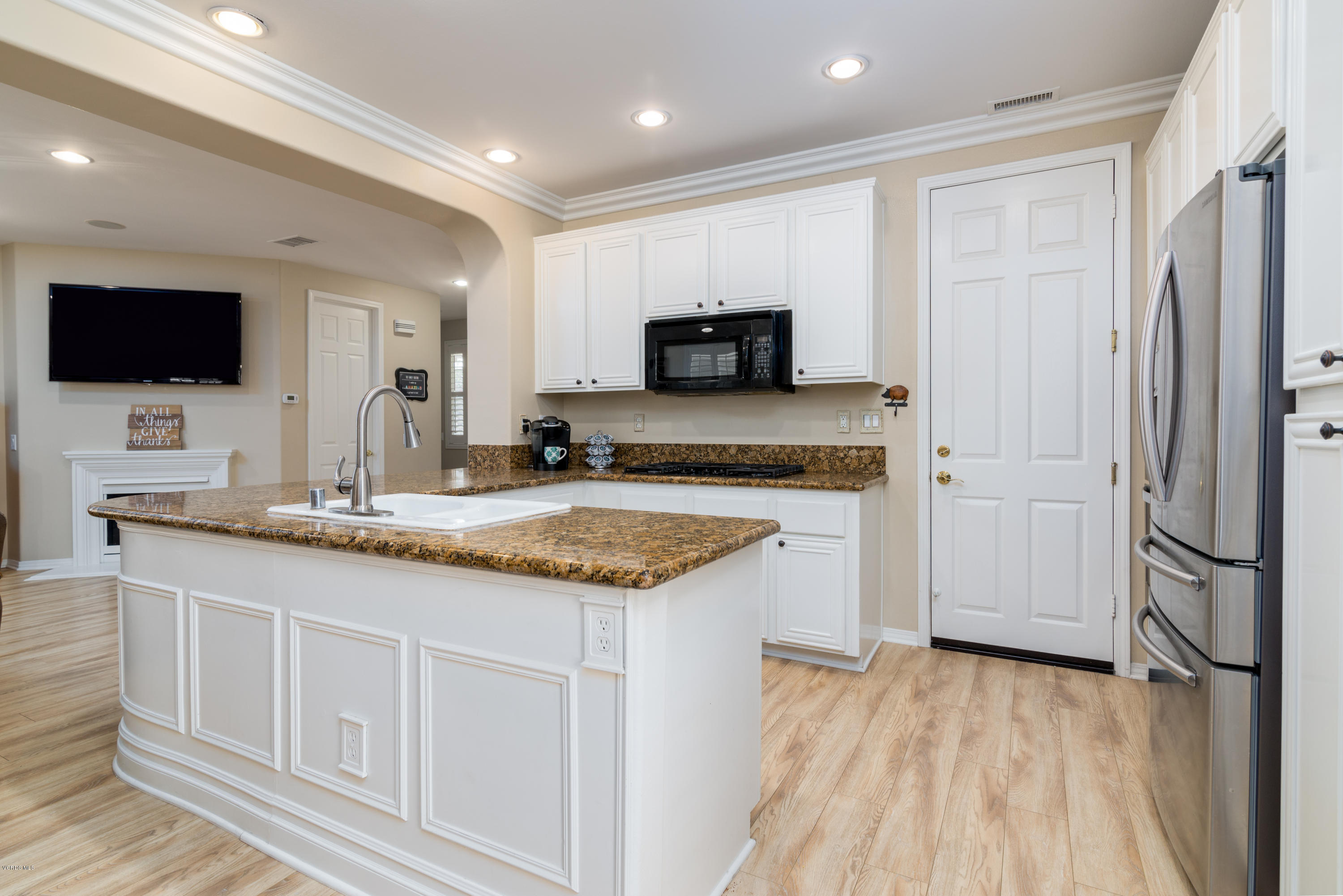 421 Spring Park Road Camarillo, CA 93012 - Photo 11 of 51 a kitchen with granite countertop a sink and a stove top oven