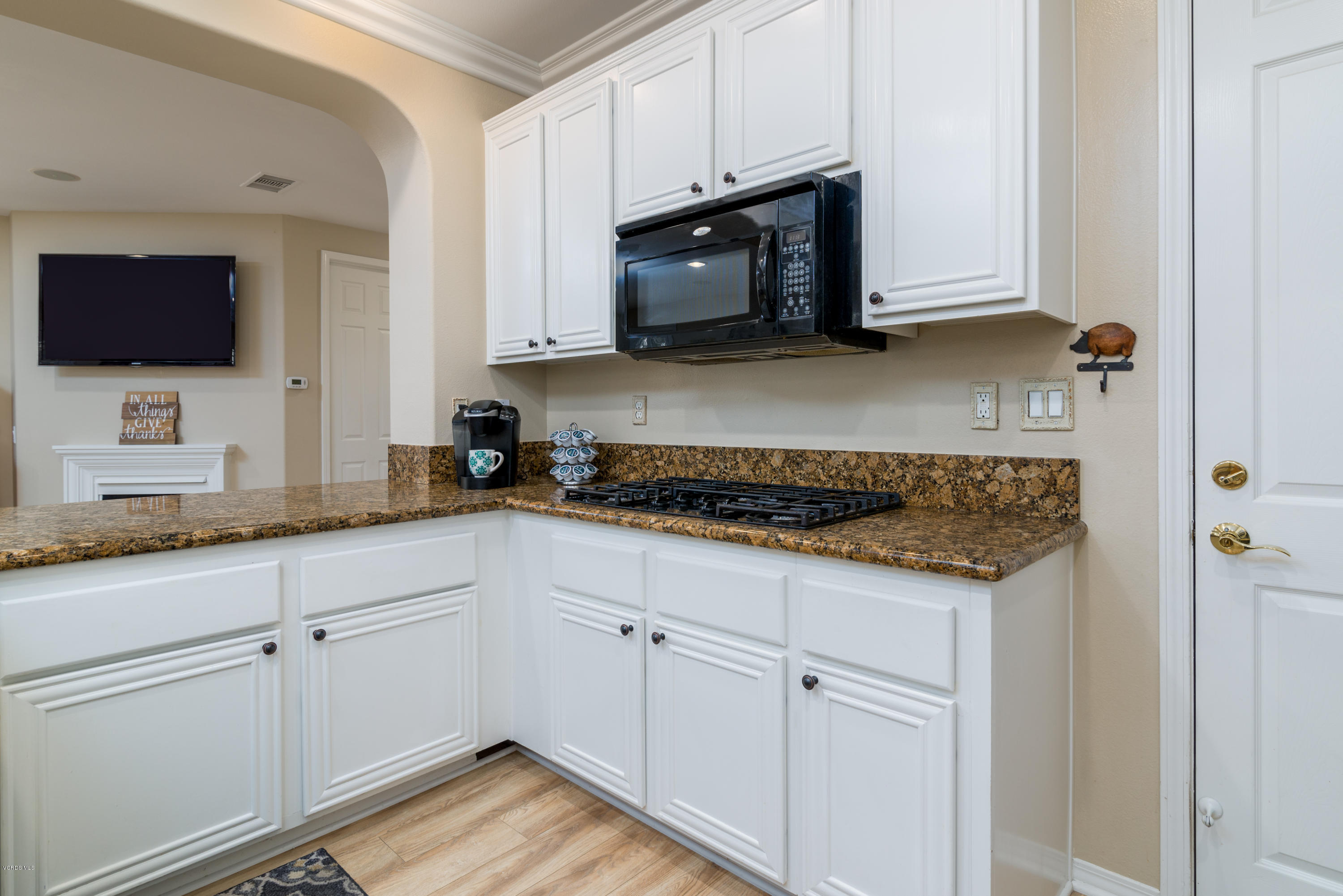 421 Spring Park Road Camarillo, CA 93012 - Photo 12 of 51 a kitchen with sink cabinets and microwave