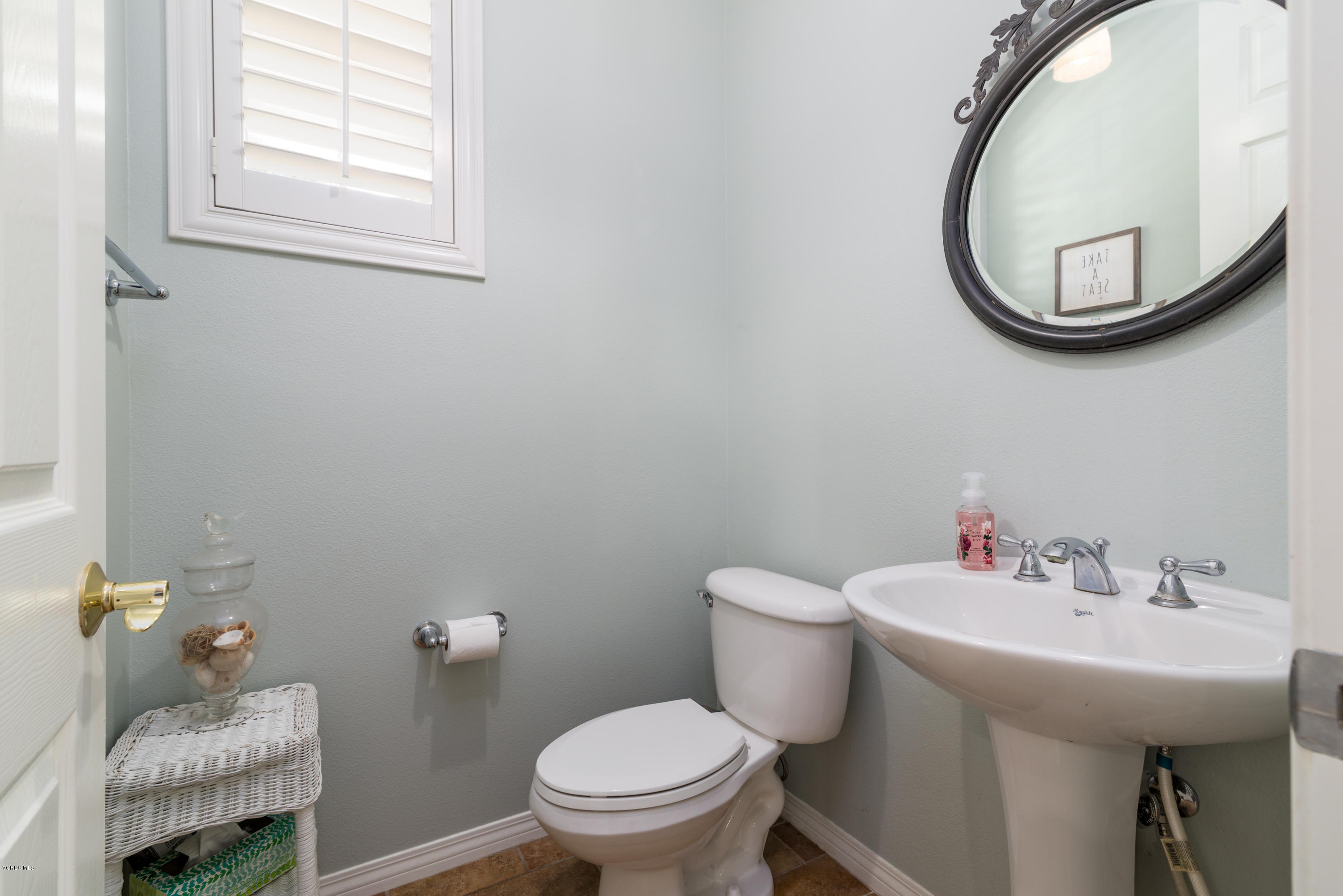 421 Spring Park Road Camarillo, CA 93012 - Photo 16 of 51 a bathroom with a toilet sink and mirror