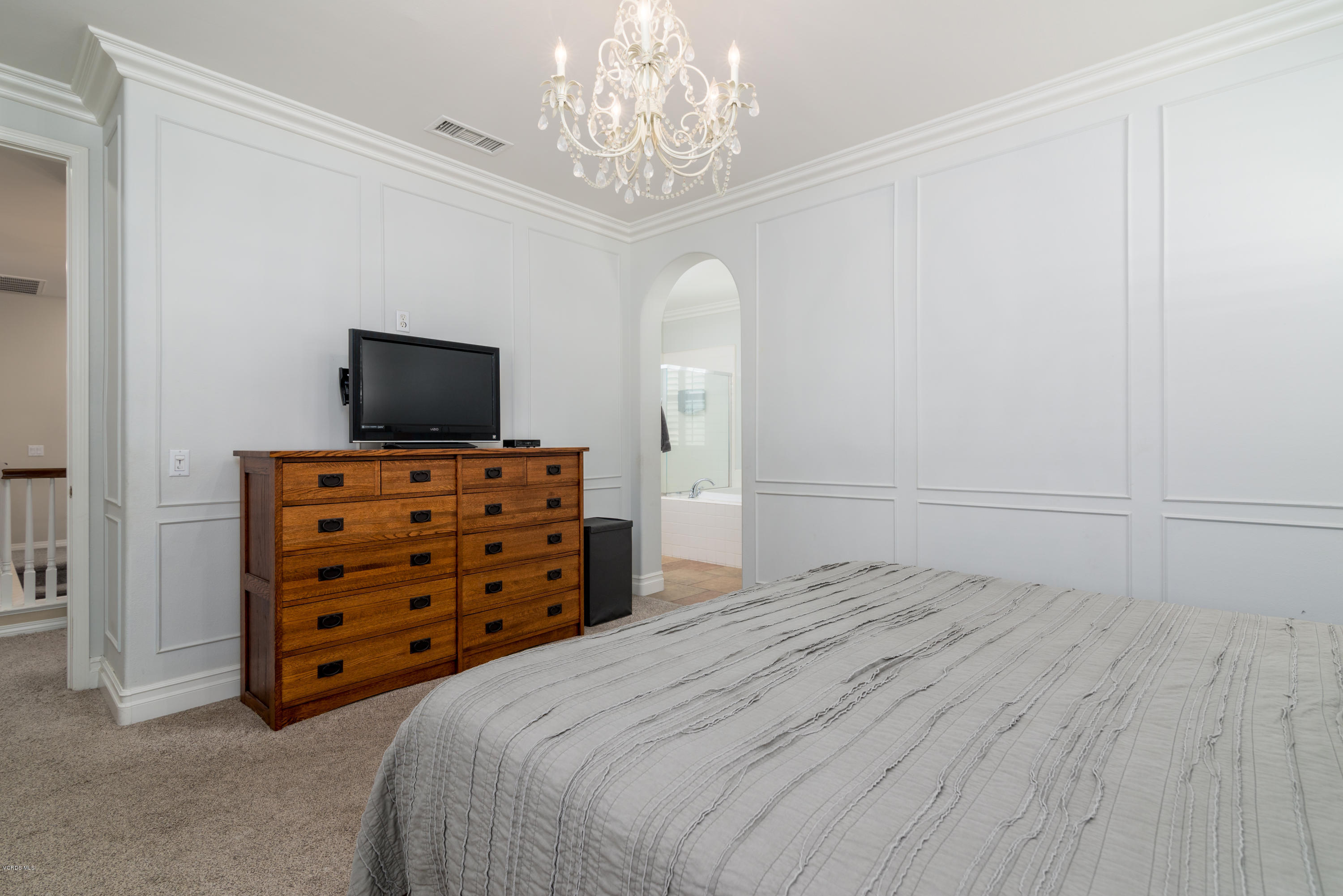 421 Spring Park Road Camarillo, CA 93012 - Photo 18 of 51 a bedroom with a bed and a flat tv screen on a dresser