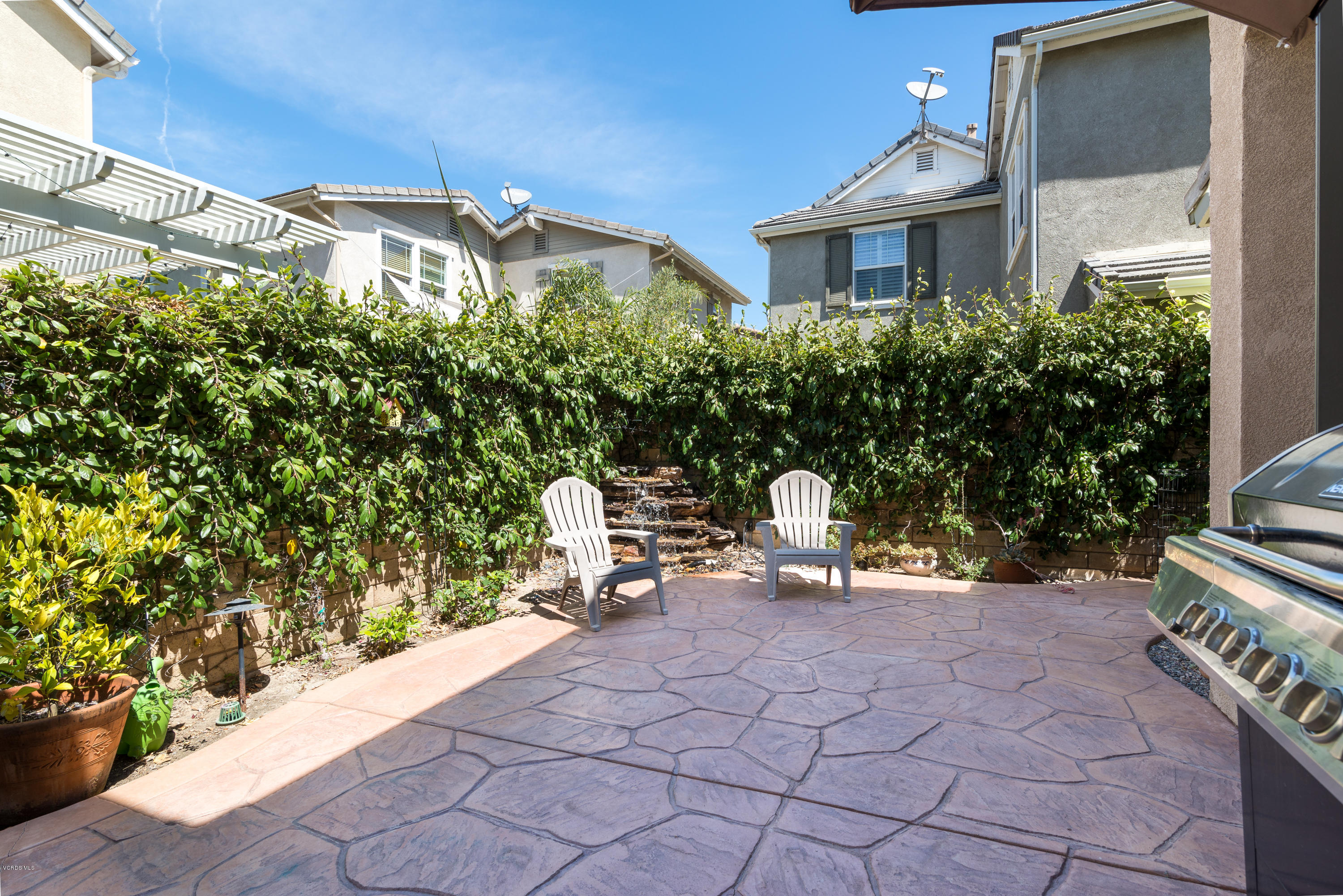 421 Spring Park Road Camarillo, CA 93012 - Photo 30 of 51 a view of a patio with table and chairs and potted plants