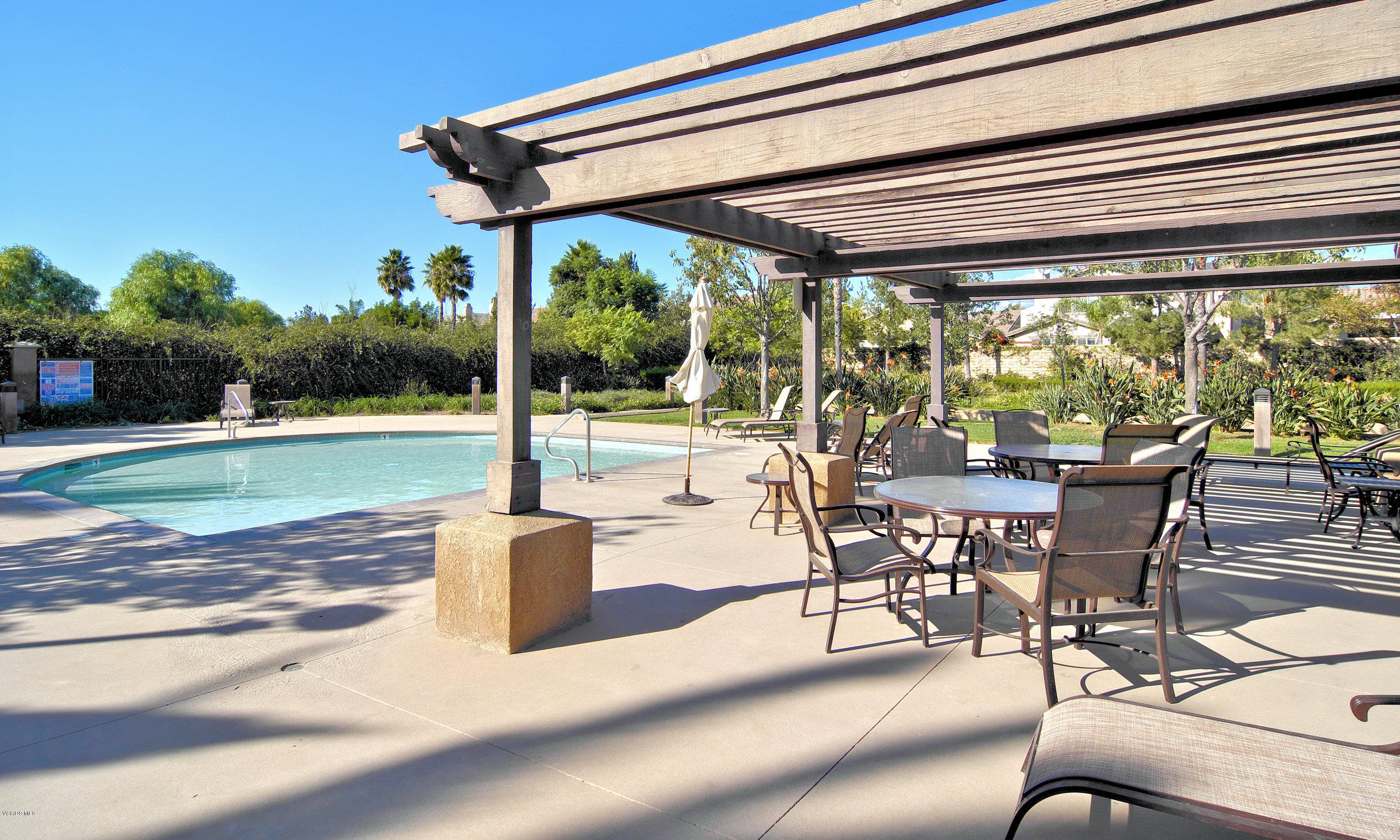 421 Spring Park Road Camarillo, CA 93012 - Photo 43 of 51 a view of a swimming pool with a table and chairs in patio