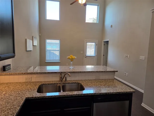 a kitchen with a sink and a window