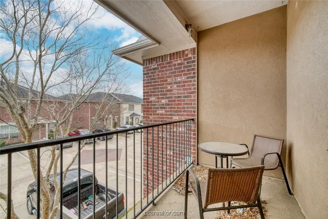 a view of balcony with furniture