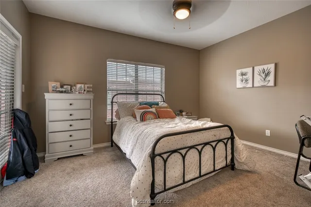 a bedroom with a bed and a closet