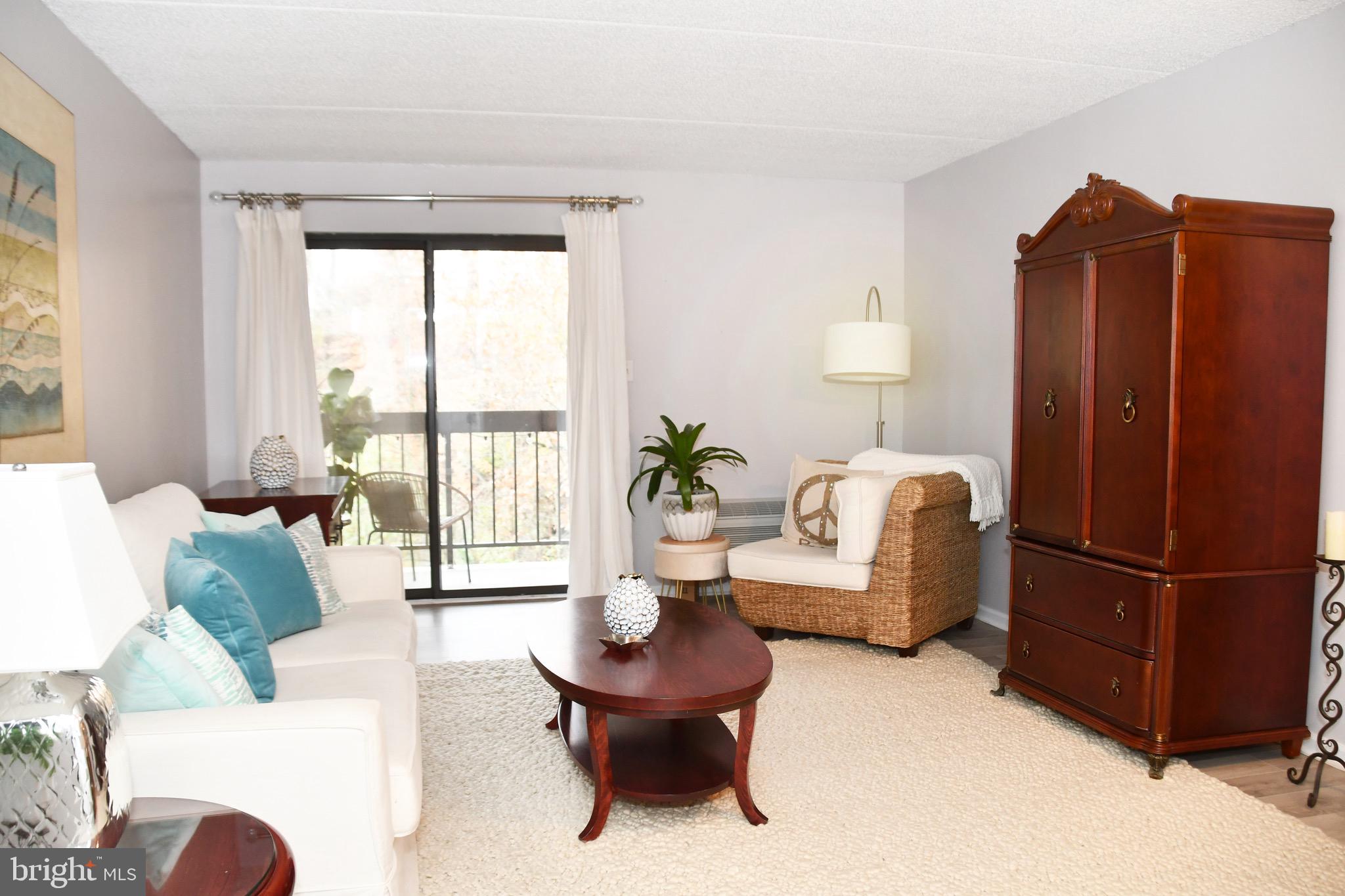 800 Avondale Road, Unit 7N Wallingford, PA 19086 - Photo 13 of 32 a living room with furniture and a window