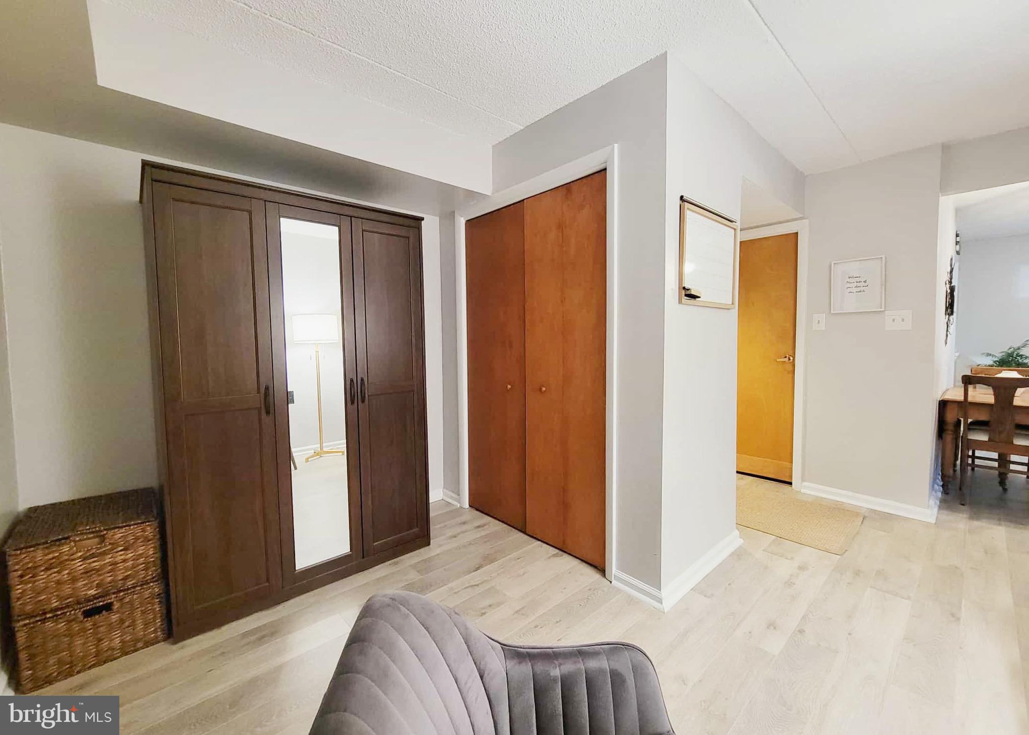 800 Avondale Road, Unit 7N Wallingford, PA 19086 - Photo 17 of 32 a bedroom with a bed and a mirror