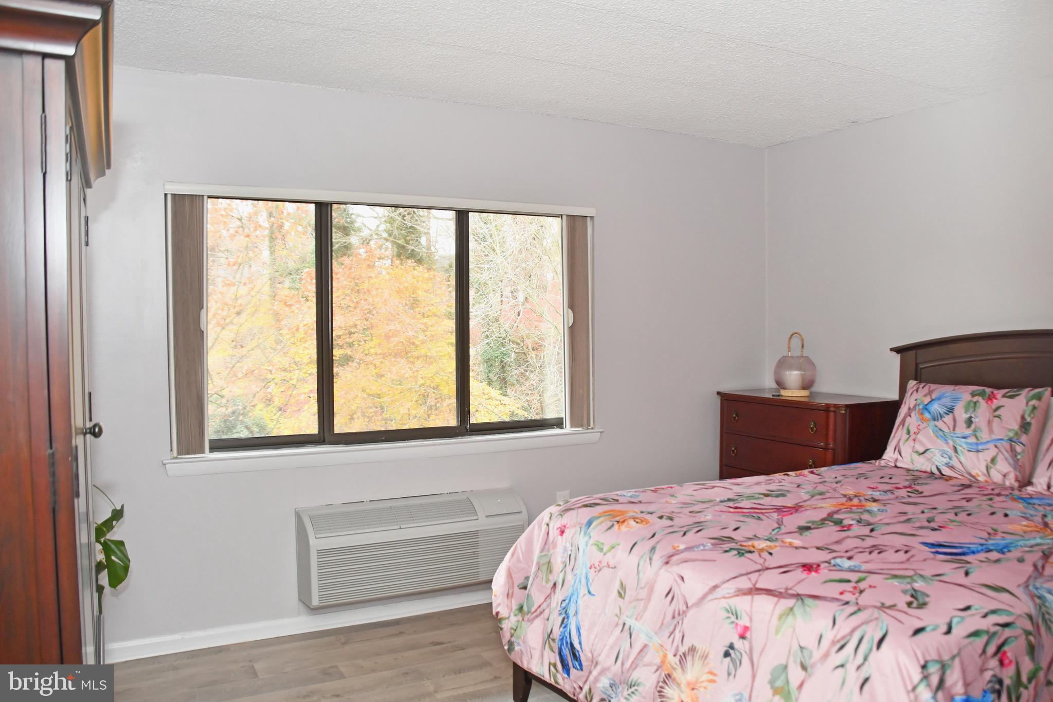 800 Avondale Road, Unit 7N Wallingford, PA 19086 - Photo 24 of 32 a bedroom with a bed and a window