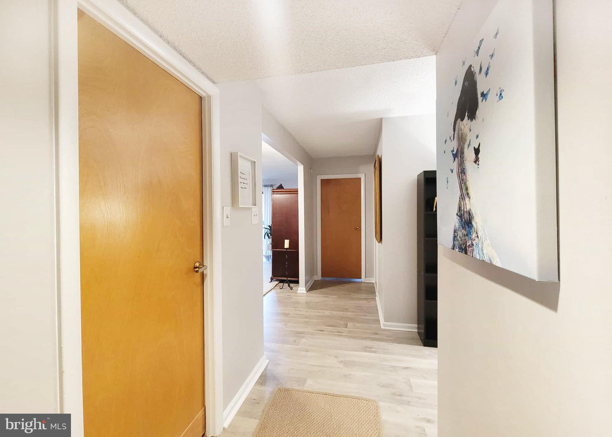 800 Avondale Road, Unit 7N Wallingford, PA 19086 - Photo 5 of 32 a view of a hallway with wooden shelves