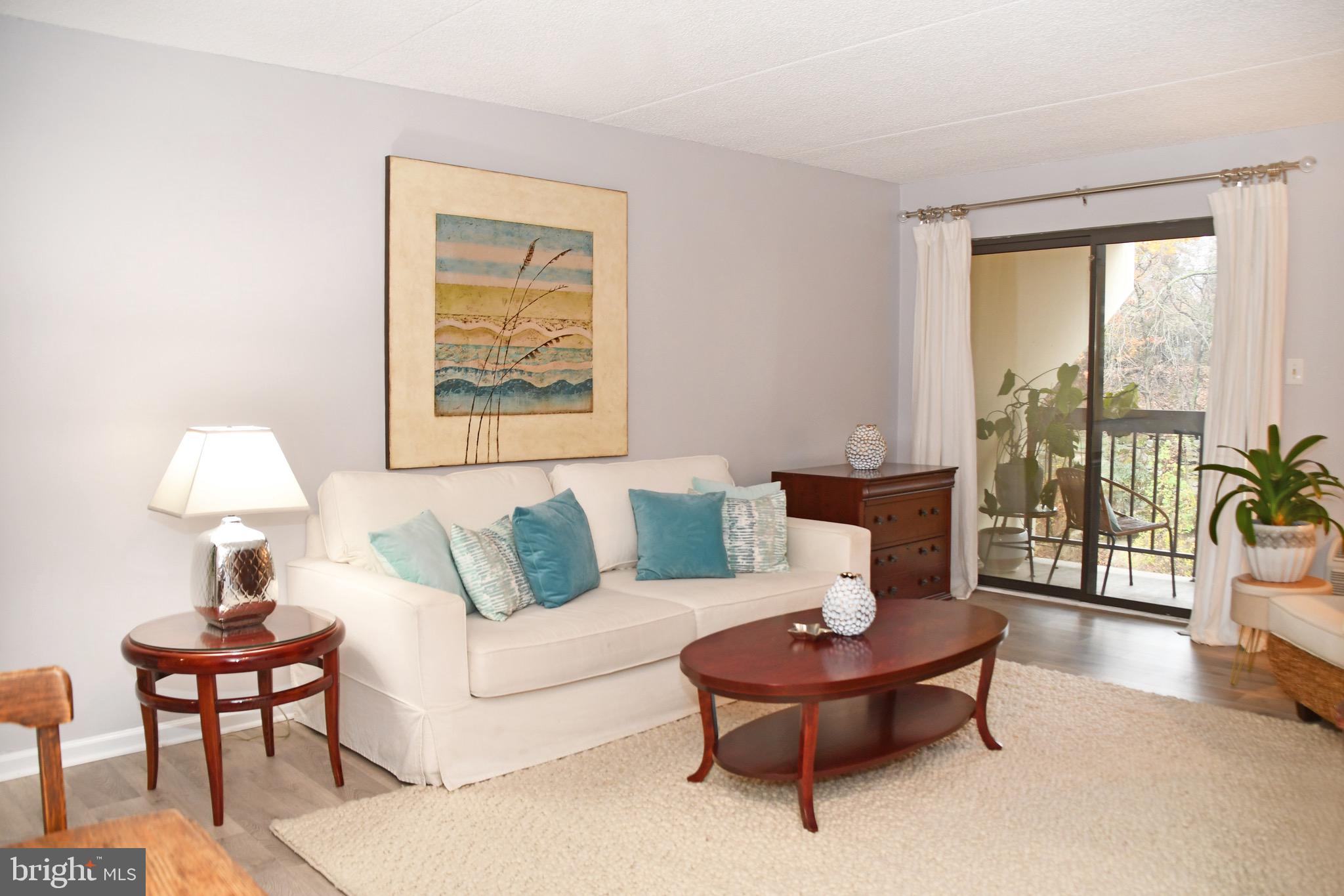 800 Avondale Road, Unit 7N Wallingford, PA 19086 - Photo 9 of 32 a living room with furniture and a large window