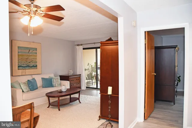 a living room with furniture and a rug