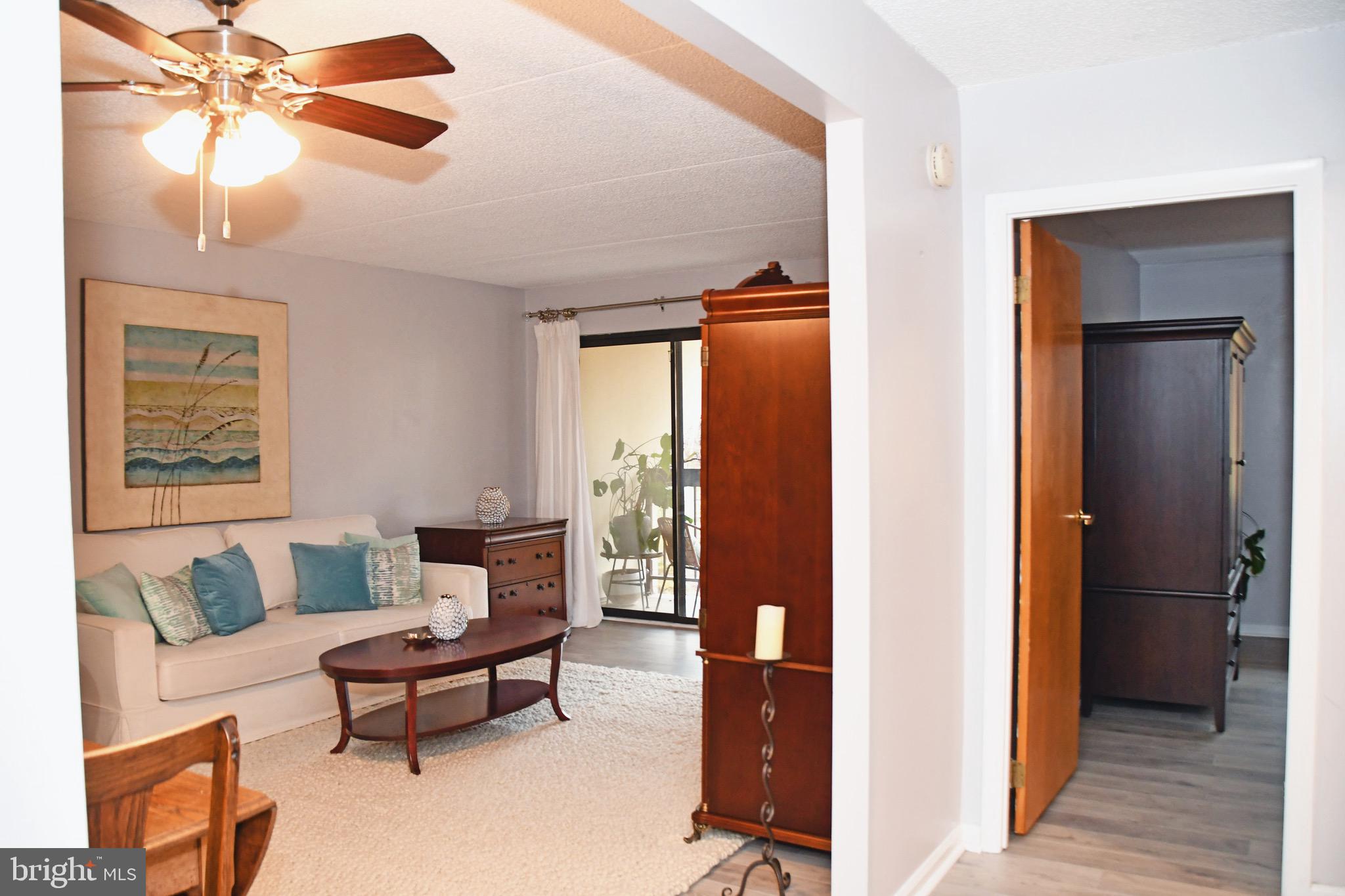 800 Avondale Road, Unit 7N Wallingford, PA 19086 - Photo 10 of 32 a living room with furniture and a wooden floor