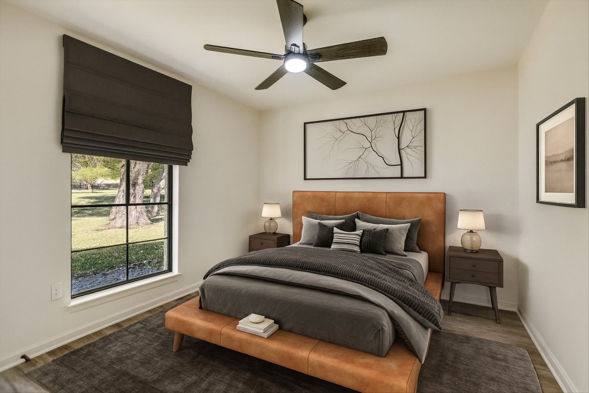 7003 Castlekeep Way Austin, TX 78745 - Photo 16 of 23 a bedroom with a bed and wooden floor