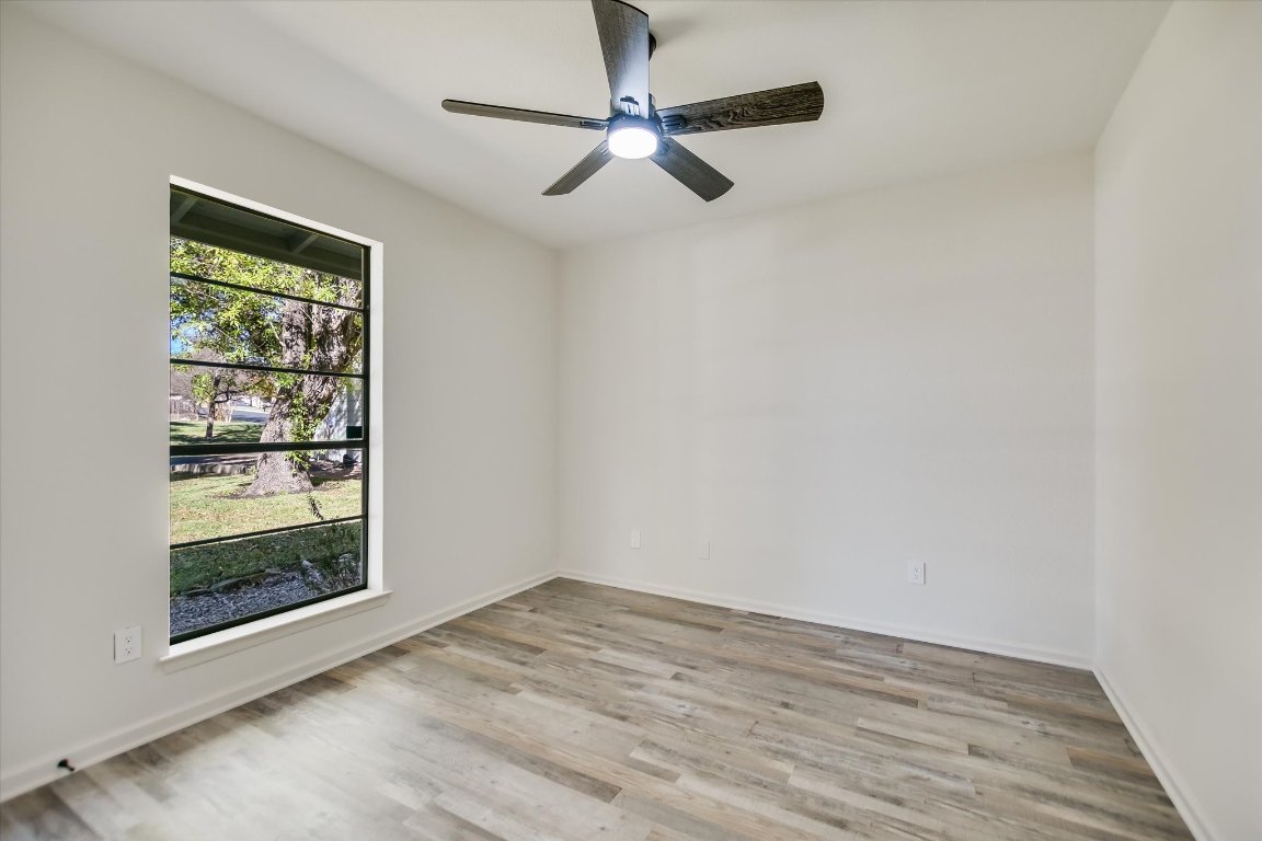 7003 Castlekeep Way Austin, TX 78745 - Photo 17 of 23 a view of room with window and ceiling fan