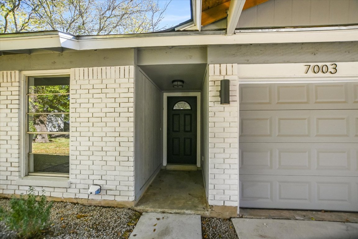 7003 Castlekeep Way Austin, TX 78745 - Photo 2 of 23 a front view of a house