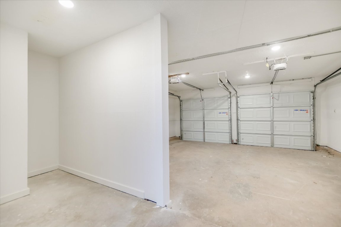 7003 Castlekeep Way Austin, TX 78745 - Photo 23 of 23 an empty room with a cabinet and mirrors