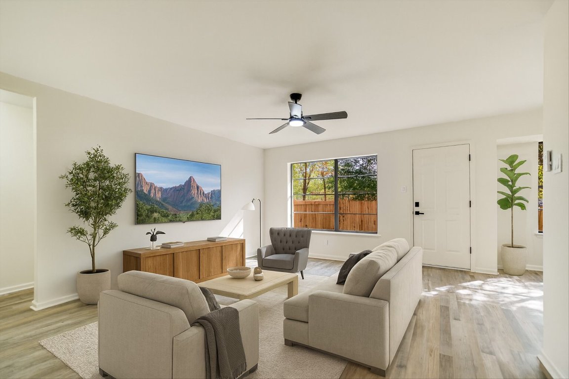 7003 Castlekeep Way Austin, TX 78745 - Photo 3 of 23 a living room with furniture and a large window