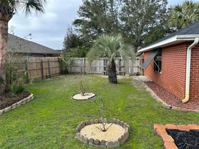 a view of backyard of a house
