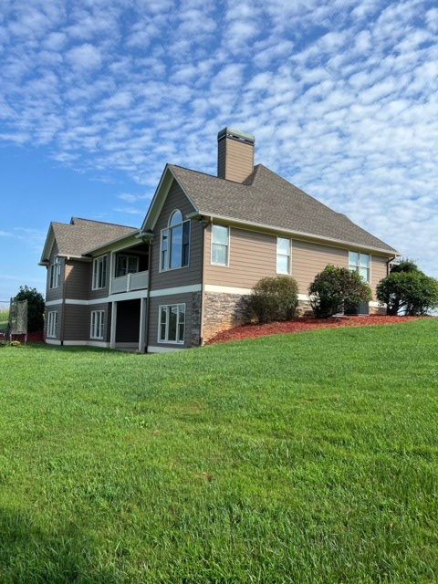 85 Ridgemont Lane Ellijay, GA 30536 - Photo 2 of 42 a front view of a house with a garden