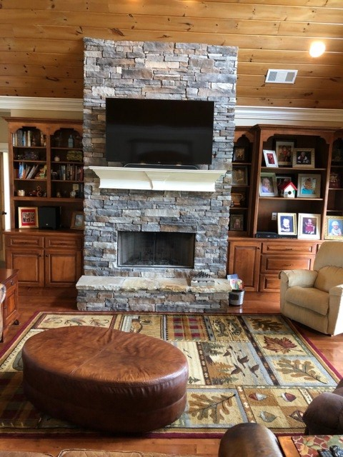 85 Ridgemont Lane Ellijay, GA 30536 - Photo 5 of 42 a living room with furniture a flat screen tv and a fireplace