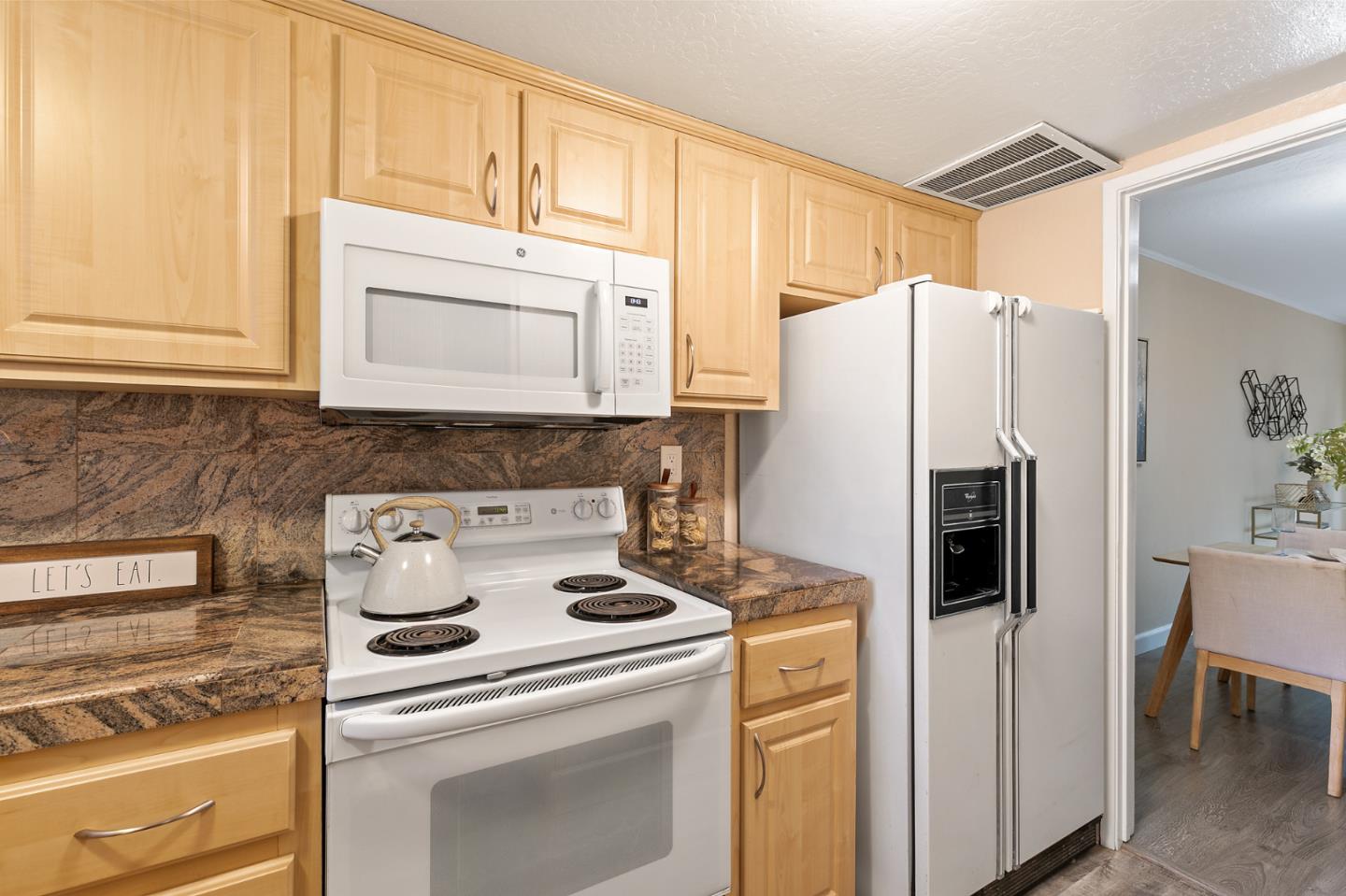 101 Redding Road, Unit A6 Campbell, CA 95008 - Photo 13 of 28 a kitchen with a refrigerator sink and cabinets