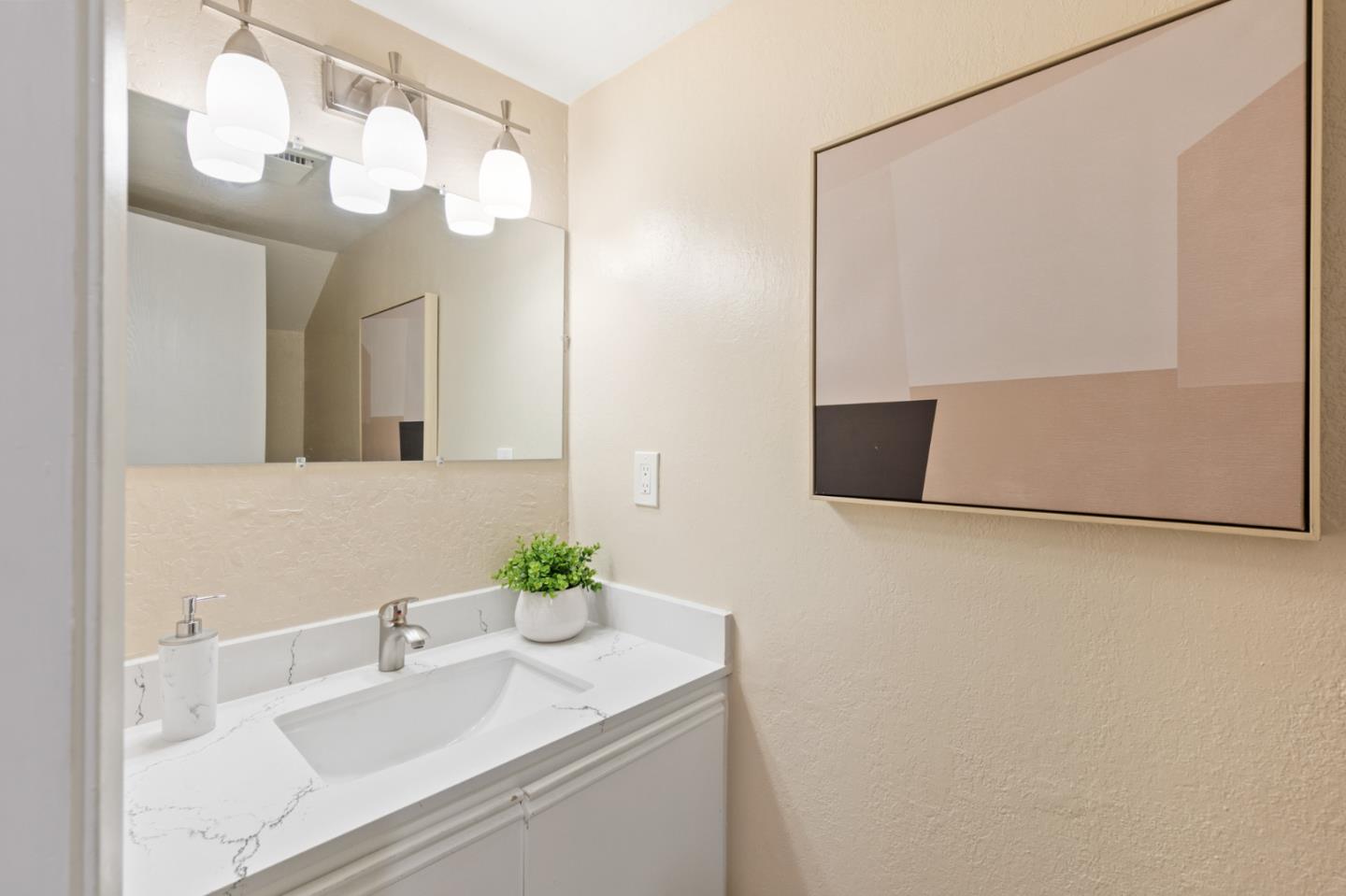 101 Redding Road, Unit A6 Campbell, CA 95008 - Photo 15 of 28 a bathroom with a granite countertop sink a mirror and a shower