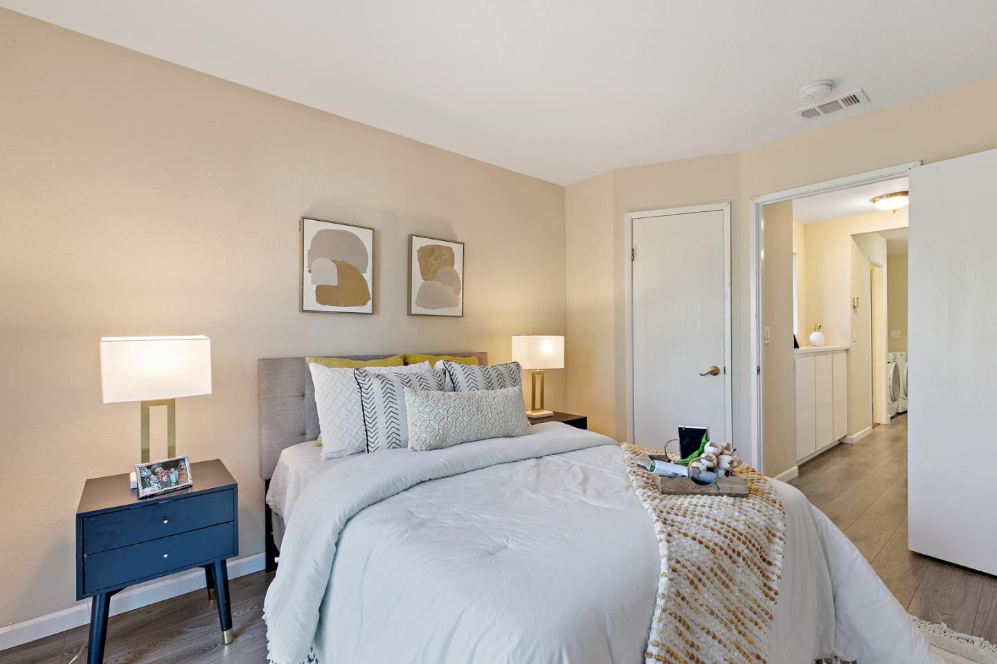101 Redding Road, Unit A6 Campbell, CA 95008 - Photo 18 of 28 a bedroom with a bed and a lamp