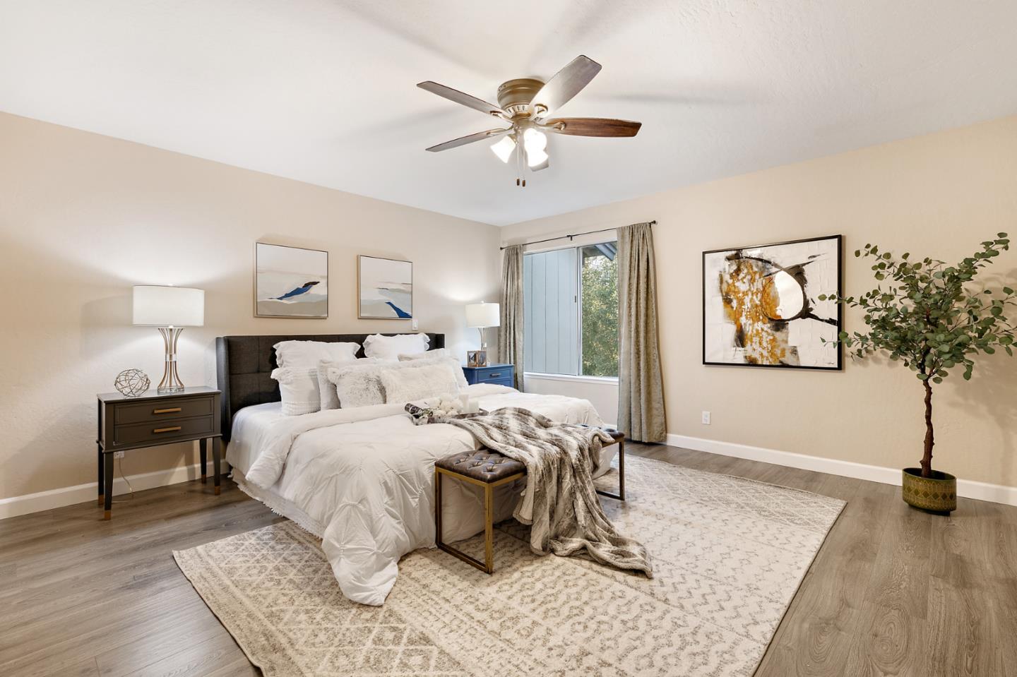 101 Redding Road, Unit A6 Campbell, CA 95008 - Photo 19 of 28 a bedroom with a large bed and a chandelier