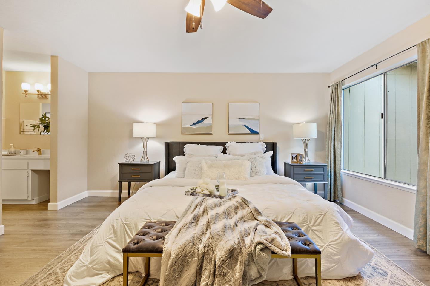 101 Redding Road, Unit A6 Campbell, CA 95008 - Photo 20 of 28 a bedroom with a bed and a chandelier
