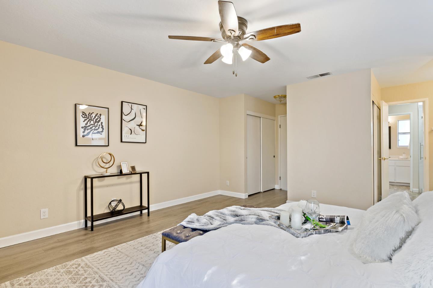 101 Redding Road, Unit A6 Campbell, CA 95008 - Photo 21 of 28 a bedroom with a bed and a chandelier