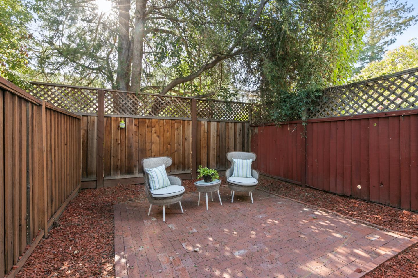 101 Redding Road, Unit A6 Campbell, CA 95008 - Photo 28 of 28 a view of backyard with a table and chairs