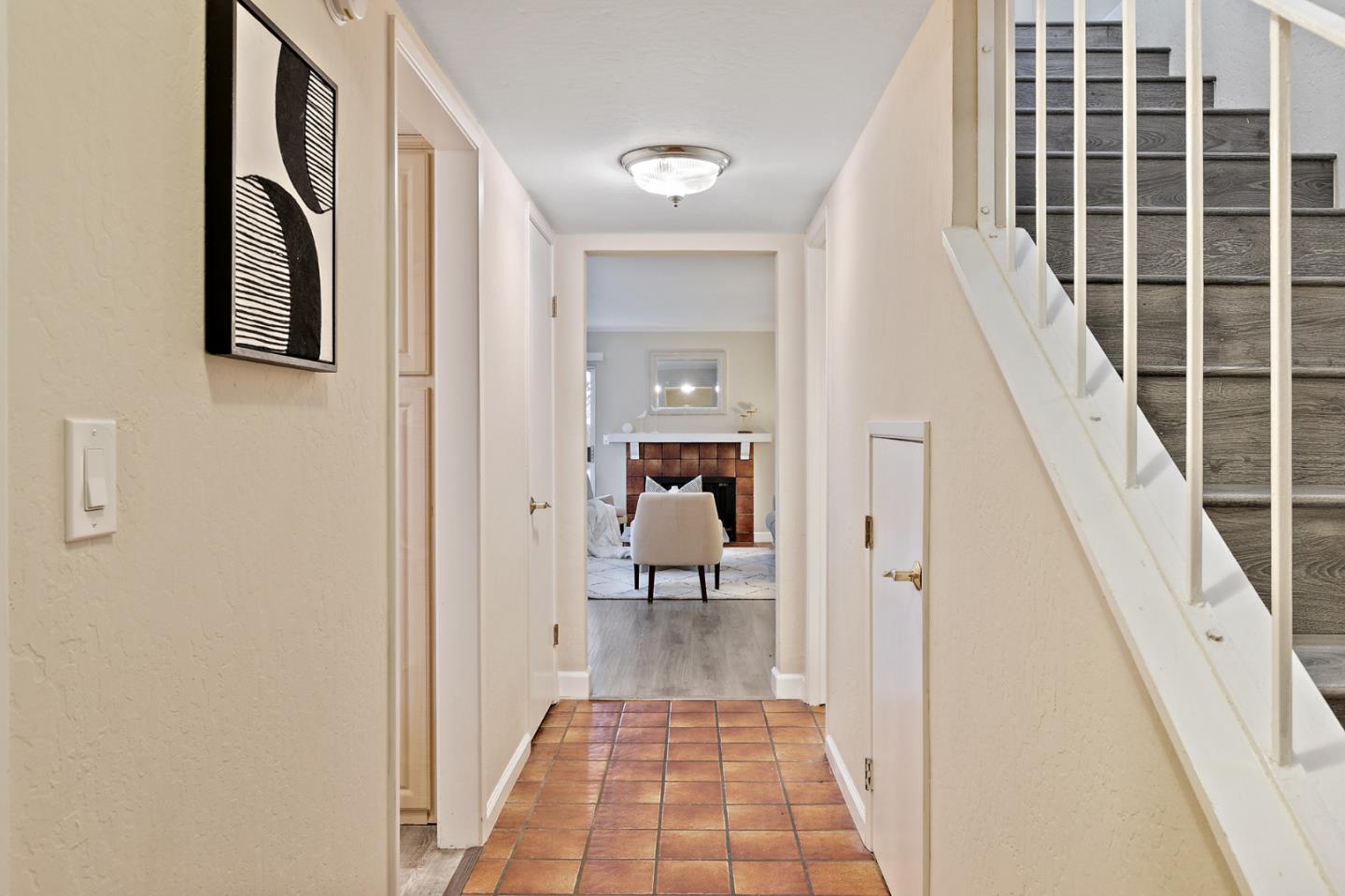 101 Redding Road, Unit A6 Campbell, CA 95008 - Photo 4 of 28 a view of a hallway with wooden floor and staircase