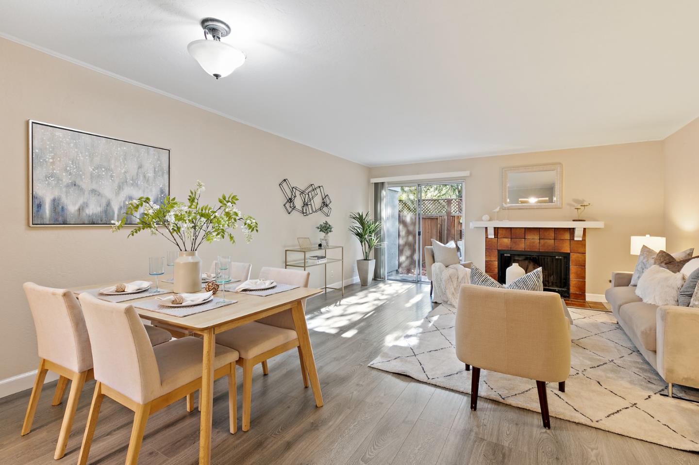101 Redding Road, Unit A6 Campbell, CA 95008 - Photo 5 of 28 a dining room with furniture potted plants and wooden floor