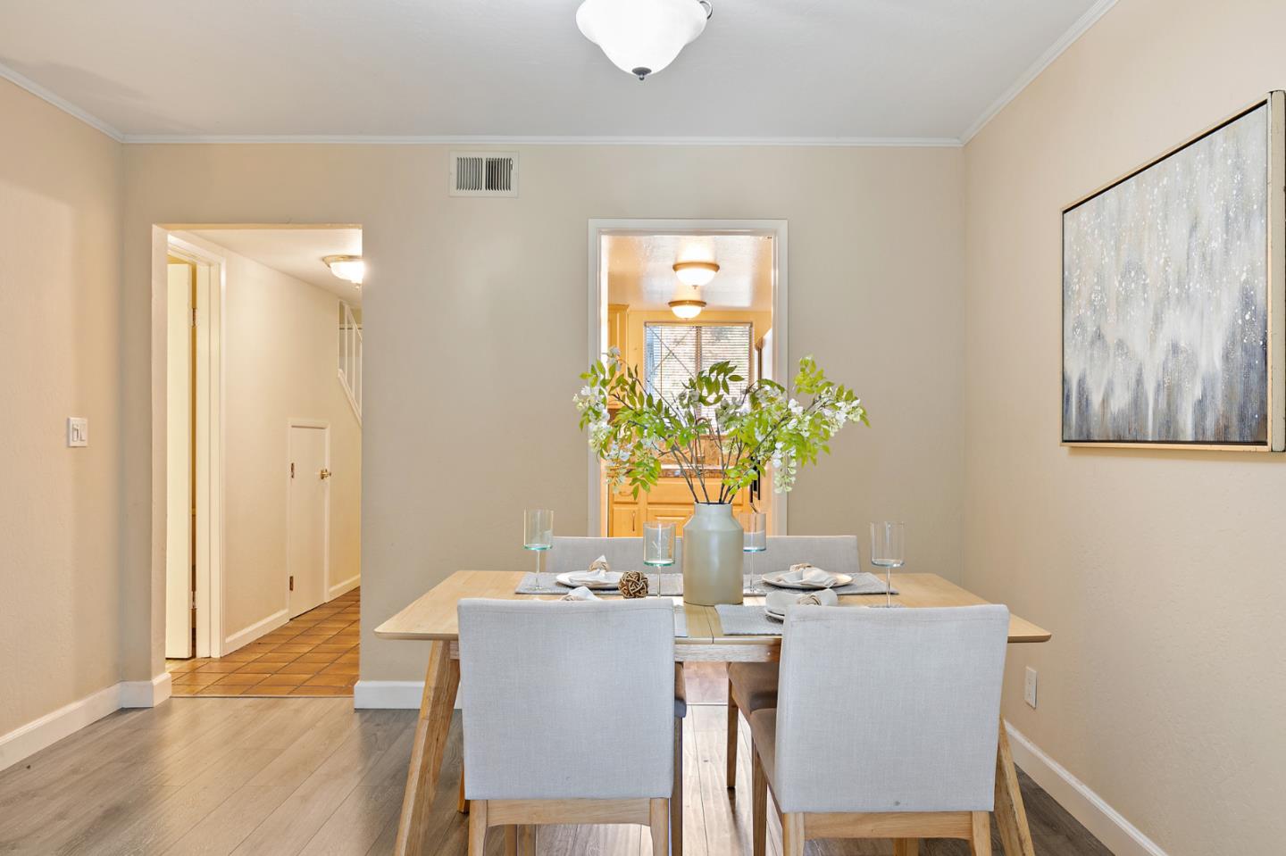 101 Redding Road, Unit A6 Campbell, CA 95008 - Photo 9 of 28 a dining room with furniture and wooden floor