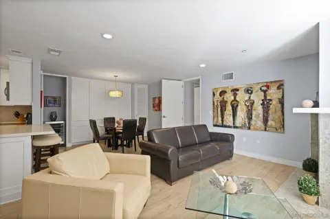 a living room with furniture and white walls