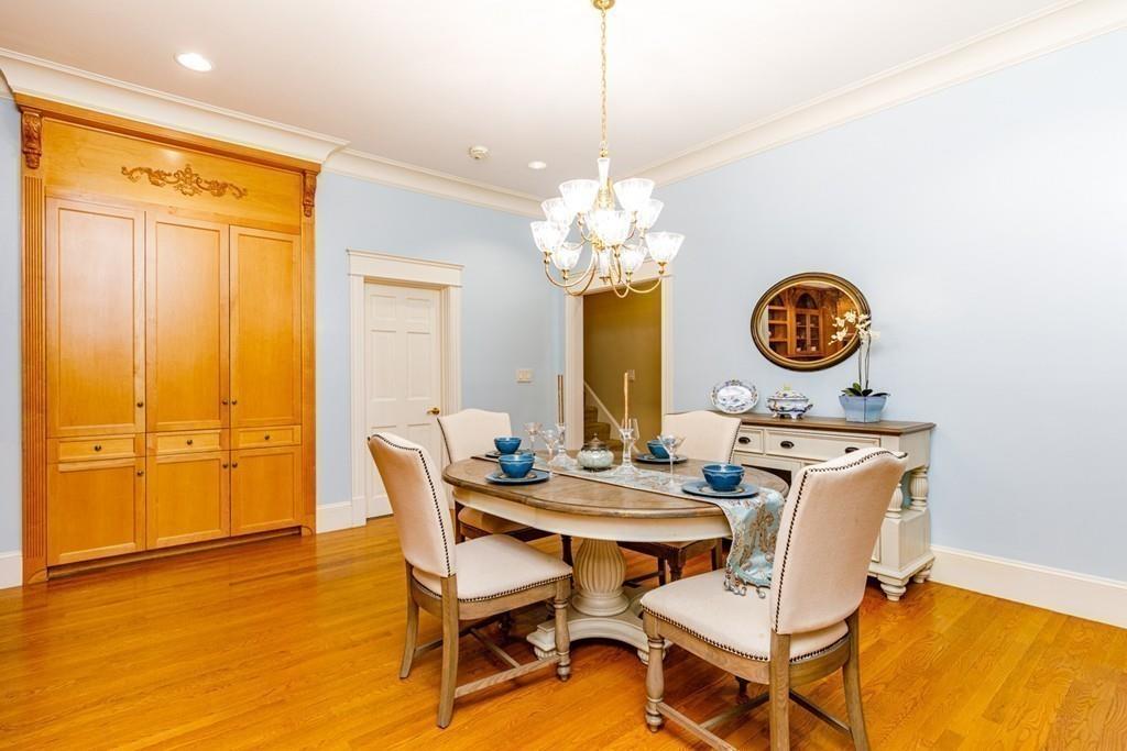23 MacMillan Drive Concord, MA 01742 - Photo 14 of 41 a view of a dining room with furniture and chandelier