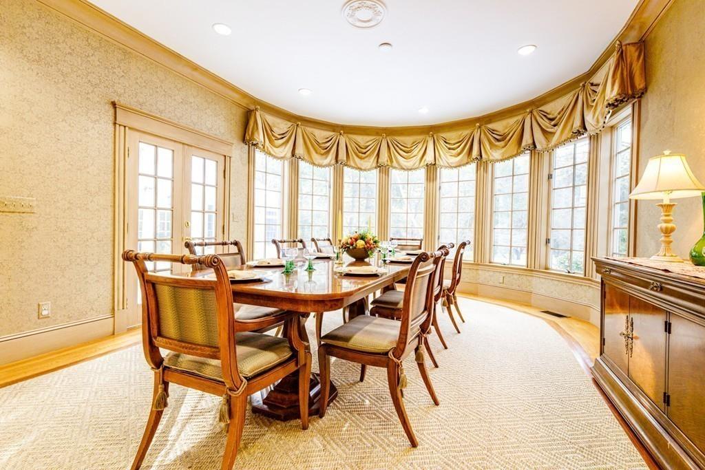 23 MacMillan Drive Concord, MA 01742 - Photo 22 of 41 a dining room with furniture and large windows
