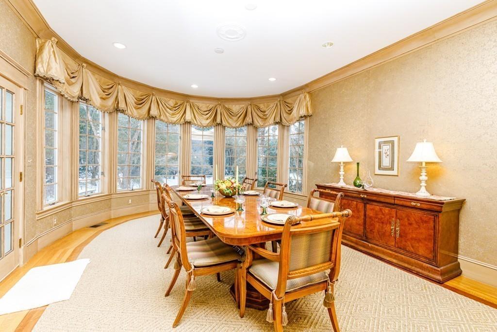 23 MacMillan Drive Concord, MA 01742 - Photo 23 of 41 a dining room with furniture and large windows