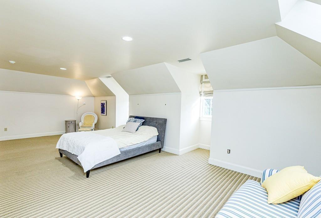 23 MacMillan Drive Concord, MA 01742 - Photo 29 of 41 a spacious bedroom with a bed and a couch