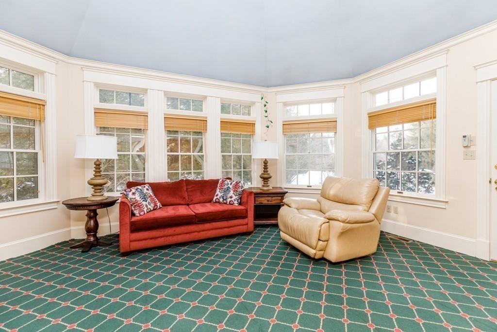 23 MacMillan Drive Concord, MA 01742 - Photo 36 of 41 a living room with furniture and a floor to ceiling window