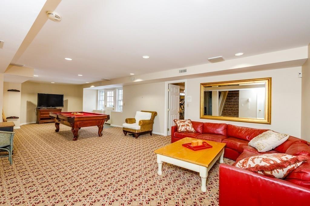 23 MacMillan Drive Concord, MA 01742 - Photo 37 of 41 a building outdoor space with patio furniture and a couch