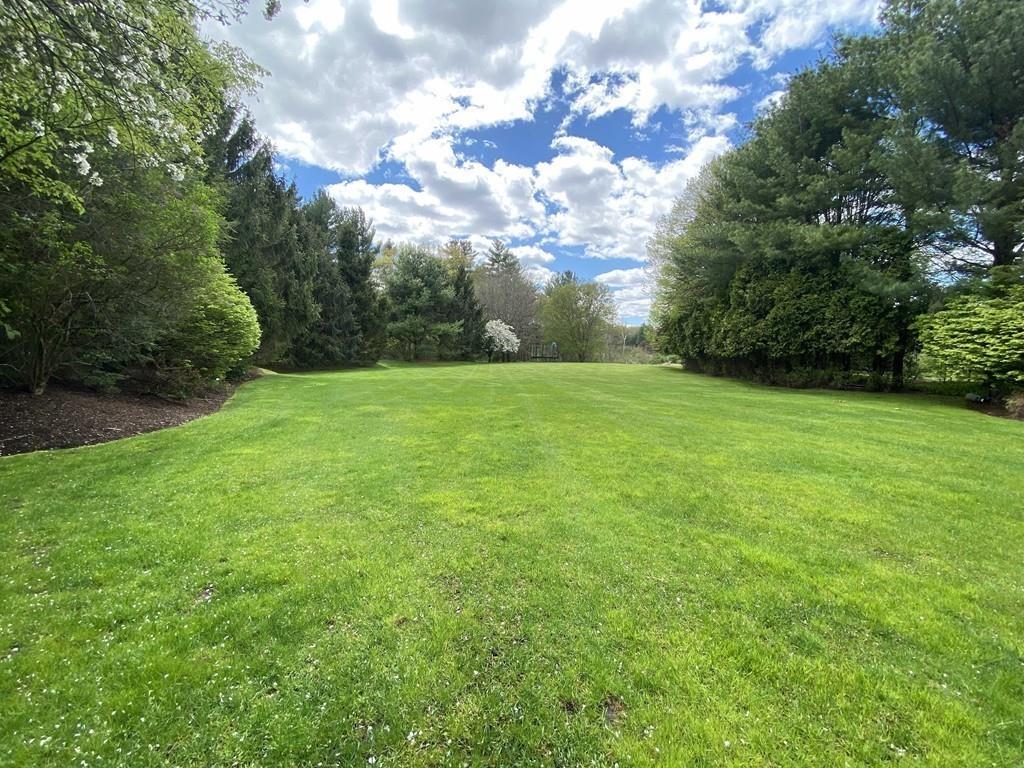 23 MacMillan Drive Concord, MA 01742 - Photo 39 of 41 a view of a big yard with a house