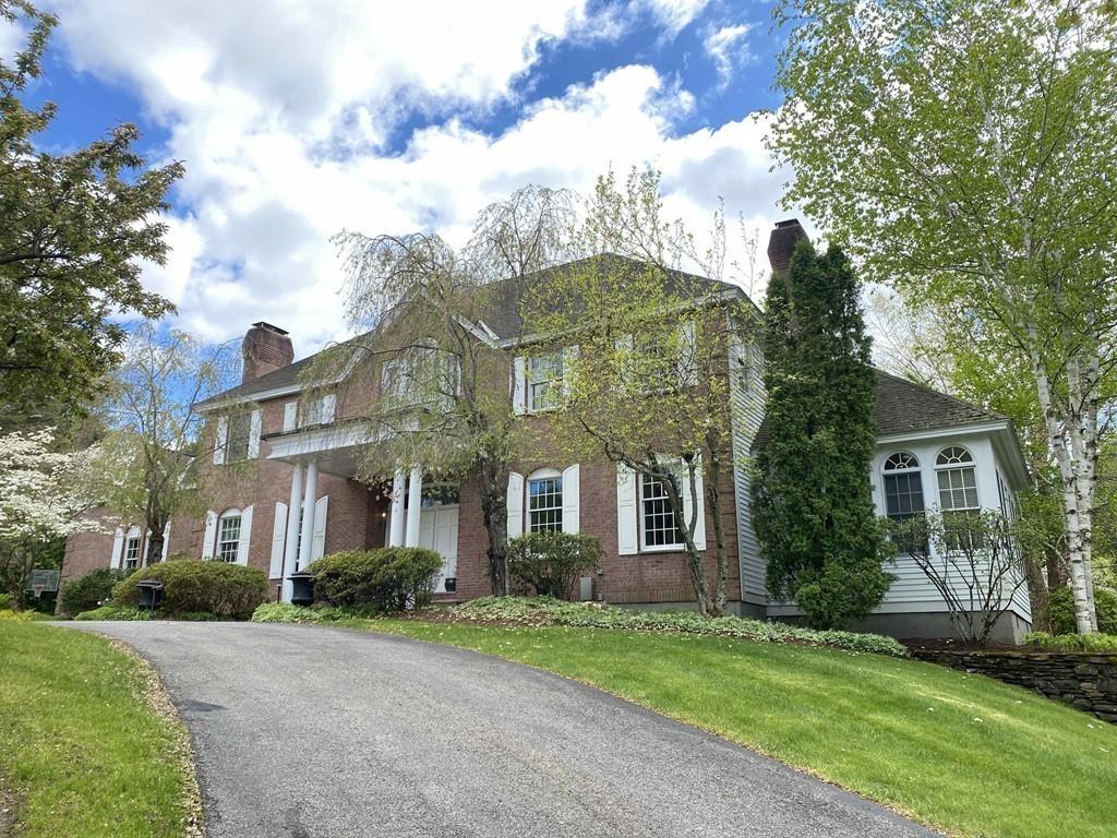 23 MacMillan Drive Concord, MA 01742 - Photo 40 of 41 a front view of a house with a garden