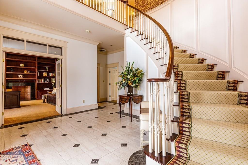 23 MacMillan Drive Concord, MA 01742 - Photo 4 of 41 a view of an entryway with wooden floor