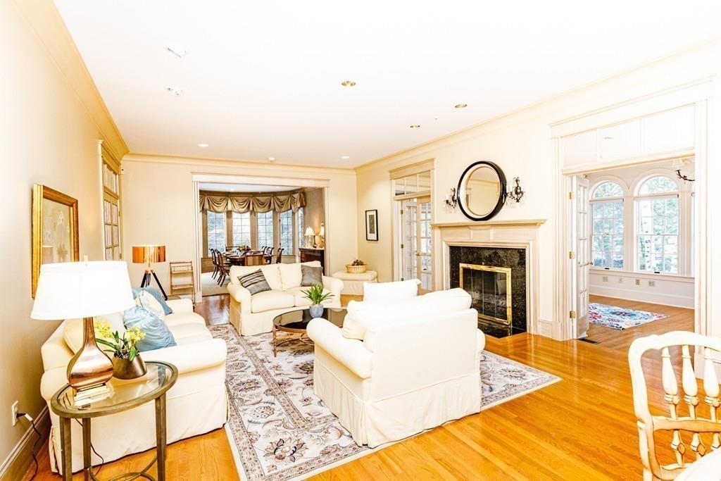 23 MacMillan Drive Concord, MA 01742 - Photo 5 of 41 a living room with fireplace furniture and a large window