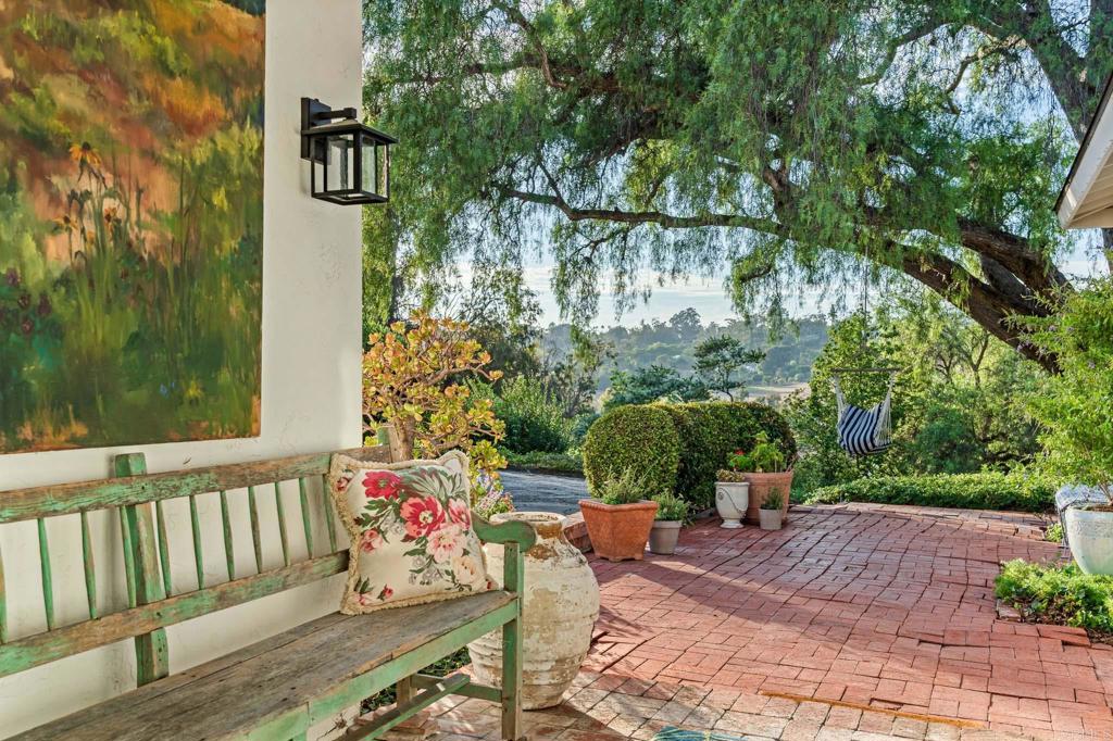 5757 San Elijo Avenue Rancho Santa Fe, CA 92067 - Photo 12 of 23 a view of a patio with table and chairs and potted plants