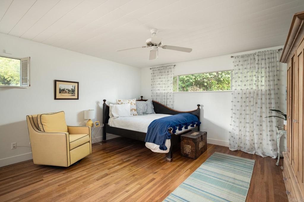 5757 San Elijo Avenue Rancho Santa Fe, CA 92067 - Photo 15 of 23 a living room with furniture and a fireplace